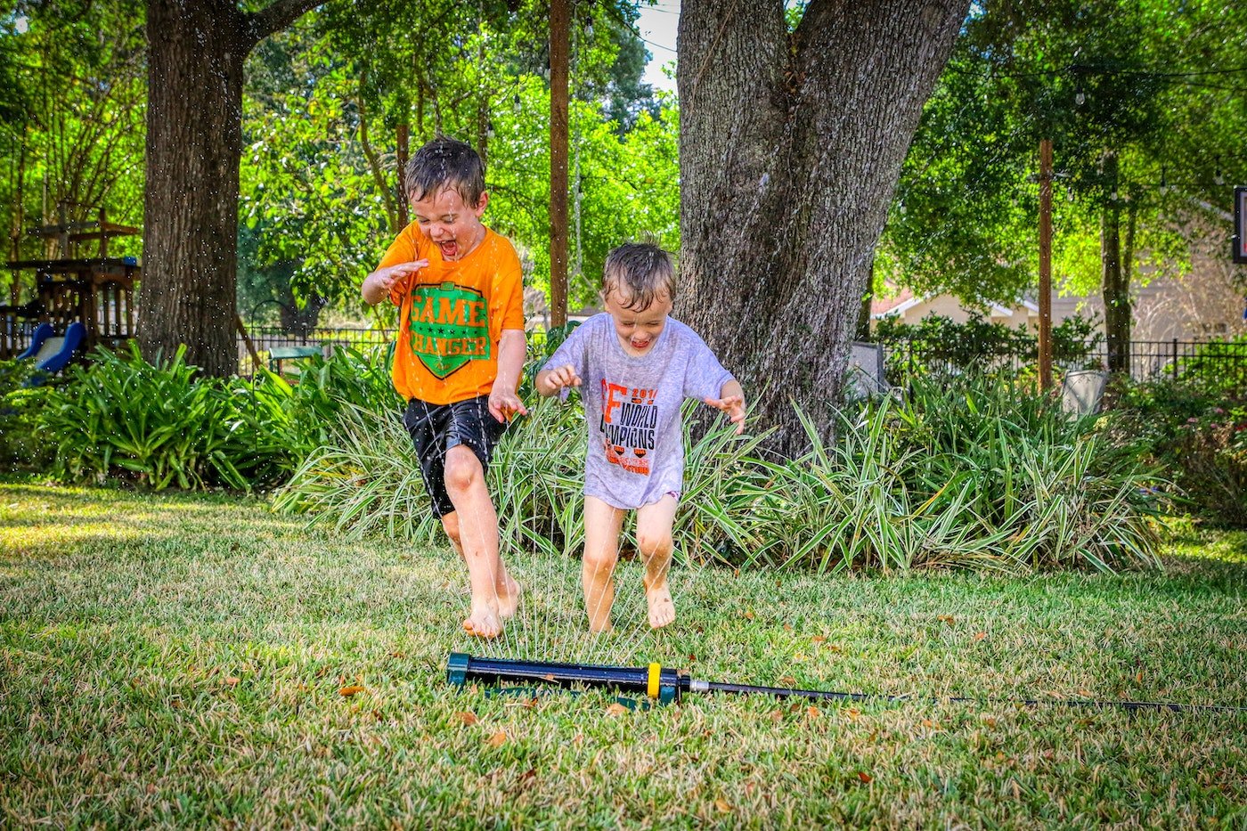 labor-day-kids-activities-playing-in-sprinkler