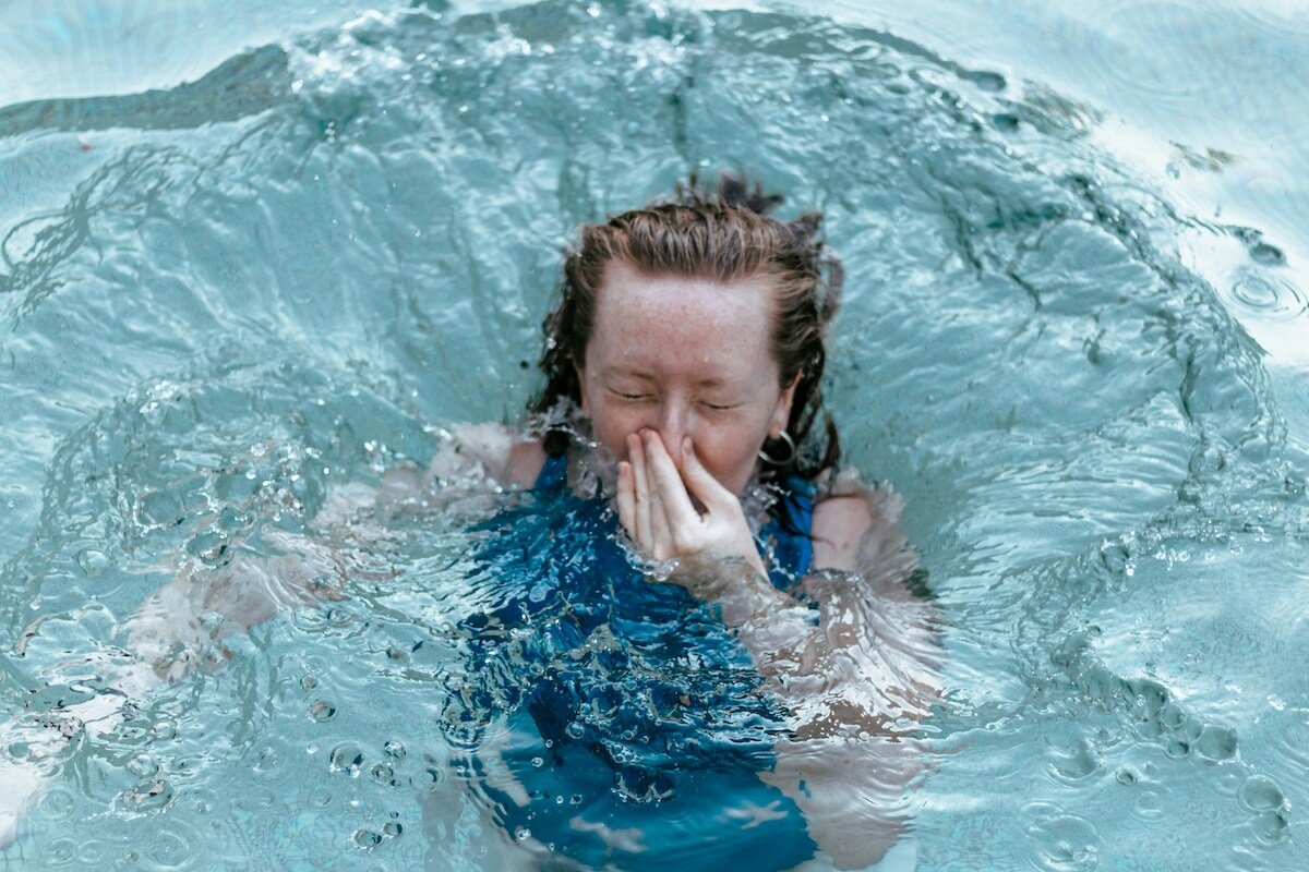 woman-jumping-into-pool